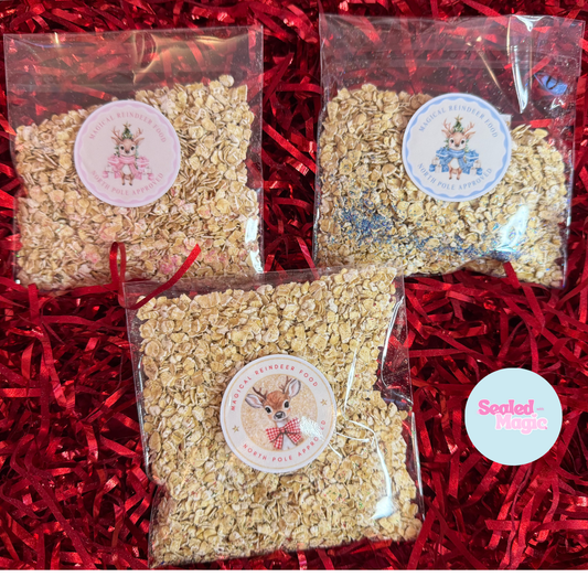 Three packages of magical reindeer food with labels on a red shredded paper background